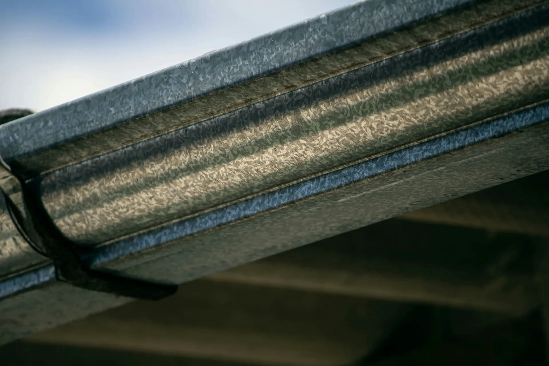 Close-up of weathered wooden boat hulls showing curved planks and natural wood grain textures